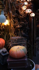 Lanterns, pumpkin, cafe cage before Halloween
