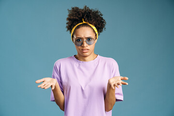 Disappointed portrait of confused multiracial woman throws up hands, cant understand how to do...