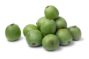 Heap of fresh whole kiwi berries close up isolated on white background
