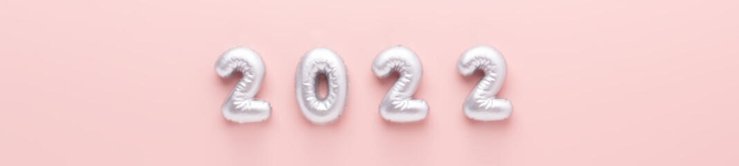 Silver numbers 2022 on pink background. New year celebration. Happy New Year concepts