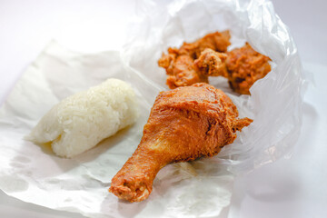 Sticky rice with fried chicken on a white background.