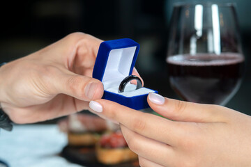 Fototapeta premium Man gives a woman payments smart ring.