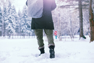 Bearded man in the winter woods. Attractive happy young man with beard walk in the park.