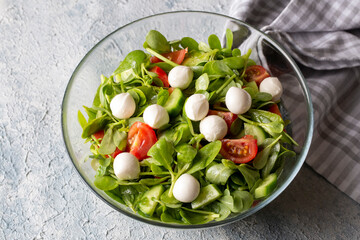 Purslane salad with cheese balls and olives inside. Healthy diet salad.