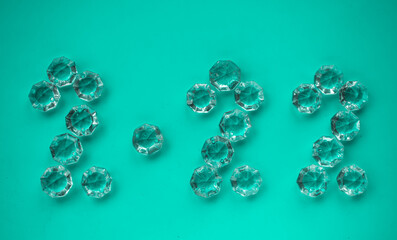 The numbers 2022 are lined with transparent crystals. New Year 2022. Background for the new year. selective focus