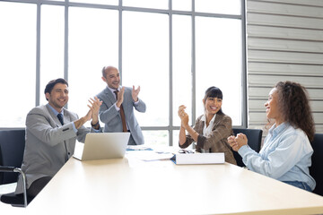 business people clapping hands together for success work in conference room