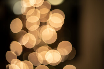 Christmas tree bokeh background , abstract bright yellow defocused lights