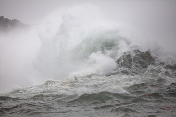 Breaking wave in the storm