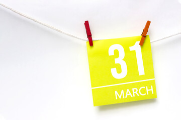 March 31st . Day 31 of month, Calendar date. Paper cards with calendar day hanging rope with...