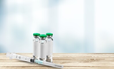 Bottle of Covid-19 vaccine on medical desk