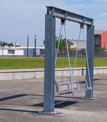 Large Metal-framed Swing in Urban Park