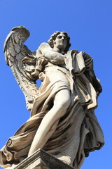 Angel with the Garment and Dice Sculpture on the Ponte Sant'Angelo Bridge in Rome Italy