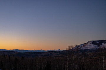 sunset with no clouds in mountains in winter