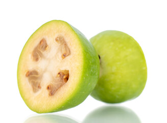 Two halves of organic sweet feijoa fruit, close-up, isolated on white.