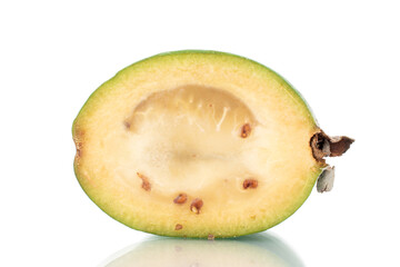 One half of organic sweet feijoa fruit, close-up, isolated on white.