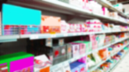 Abstract blur image of supermarket background. Defocused shelves with fresh products. Grocery shopping. Store. Retail industry. Food quality. Rack. Discount. Inflation and crisis concept. Aisle.