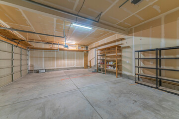 Large garage interior with wall filler white markings and shelves