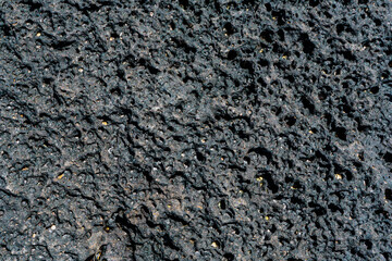 Black volcanic stone macro closeup. High quality photo