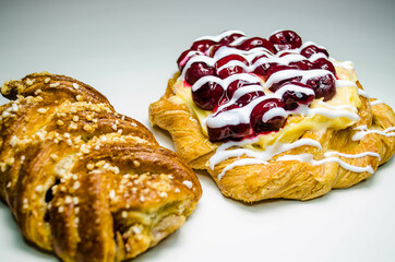 
Pastries, cherry puff and cherry puff and cream, photo on white
