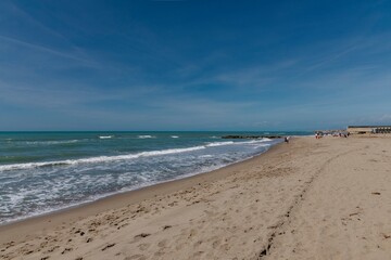 Sea with waves in the foreground on the shoreline