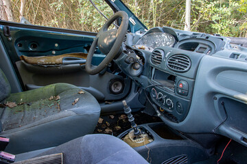 Interior of a damaged car parked in nature