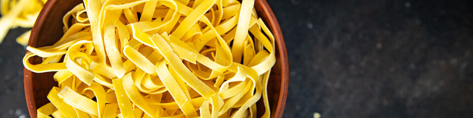 egg pasta raw tagliatelle handmade cooking durum wheat meal on the table copy space food background