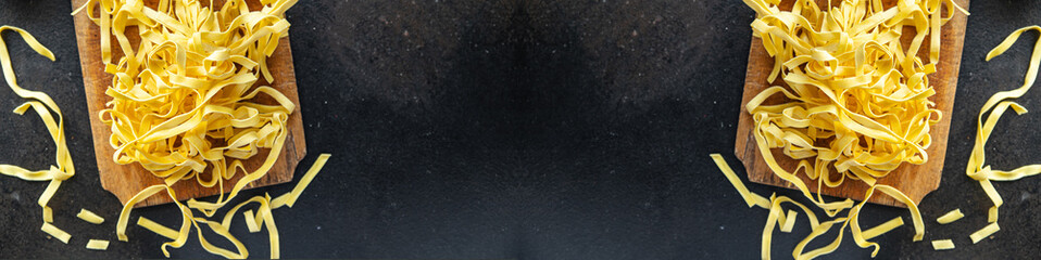 egg pasta raw tagliatelle handmade cooking durum wheat meal on the table copy space food background