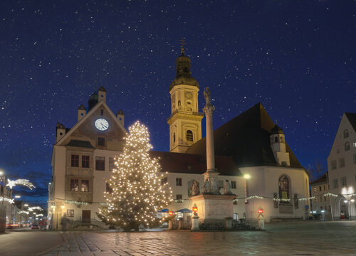Beautiful christmas tree in front of church at blue hour