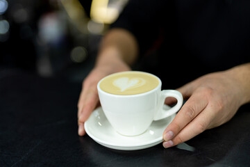 Coffeemaking by barista in reataurant. Espresso making with milk in cafeteria.