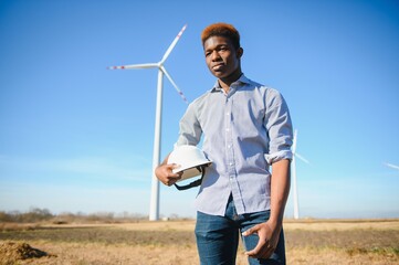 Engineers are investigating the wind turbine.