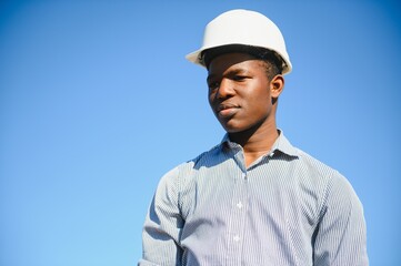 Portrait of happy African construction over with hardhat
