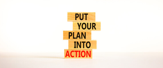 Put your plan into action symbol. Wooden blocks with words Put your plan into action. Beautiful...
