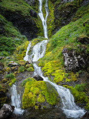 Fototapeta na wymiar A waterfall on Umnak Island in Alaska's Aleutian Islands. Alaska Maritime National Wildlife Refuge.