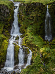 Fototapeta na wymiar A waterfall on Umnak Island in Alaska's Aleutian Islands. Alaska Maritime National Wildlife Refuge.