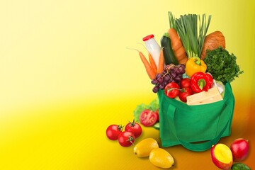 Fresh ripe vegetables in grocery bag
