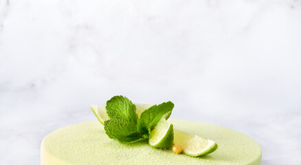 Banner Poster green lime cake. Make background with free space for text. White background. Copy space, selective focus. Bakery shop concept for web design slider.