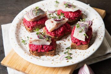 herring appetizer. Herring with beets on rye bread. Brain food concept. Home cooking