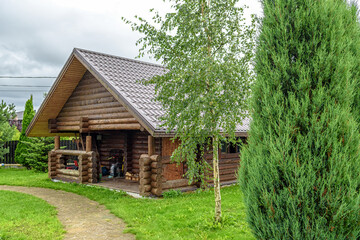 Wooden log house on a country plot.
