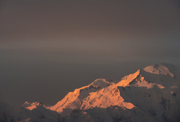 The eastern shoulder of Denali (Mt. McKinley) lit up during sunrise in Denali National Park, Alaska. 