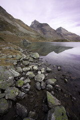 rocky landscape with lake and mountains