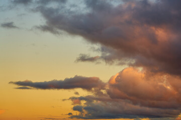 Obraz na płótnie Canvas Colorful clouds in the setting sky as a background.