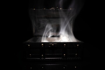 Small wooden chest in the dark closeup