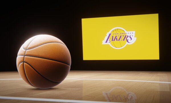 Basketball in foreground with logo of NBA team Los Angeles Lakers projected on screen in background. Editorial 3D illustration