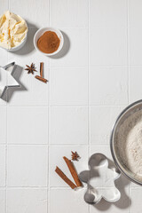 Ingredients for Christmas gingerbread with cinnamon, anise, flour on a white table
