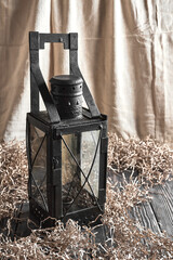 Old candle lantern in the interior
