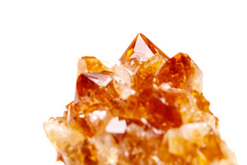 Macro mineral stone Citrine in rock in crystals on a white background