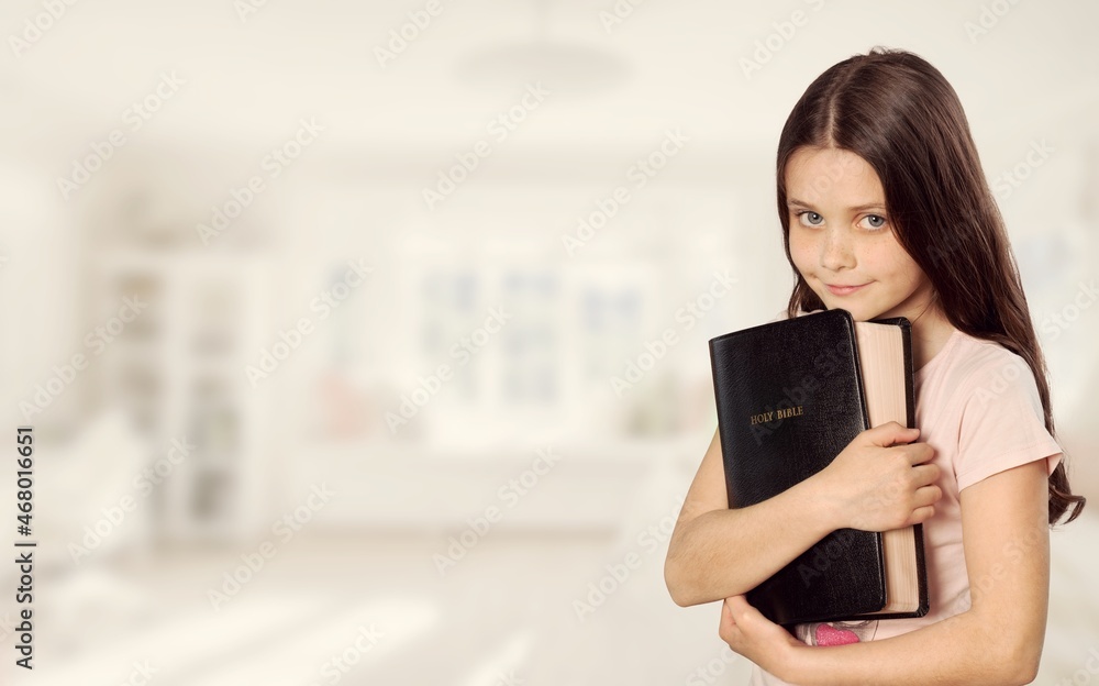 Wall mural happy kid girl read bible study. worship at home.