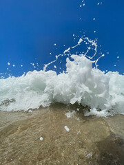 waves on a beach, sea waves, blue sky and sand, picture to frame