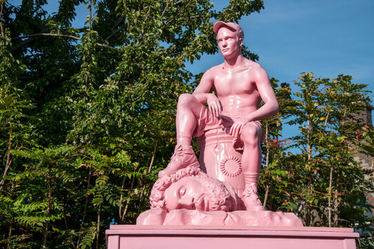 Pink sculpture of David and Goliath