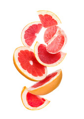 Falling cut grapefruit on white background